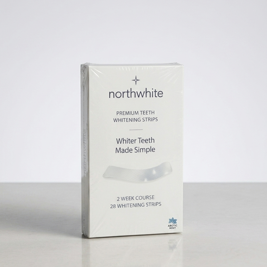 A boxed product labeled northwhite Premium Teeth Whitening Strips stands upright on a light gray surface against a pale gray background. The package is mostly white with black text and a small blue logo near the bottom.