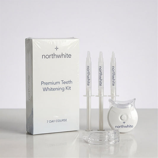 Northwhite Premium LED Teeth Whitening Kit with three pre-filled gel syringes and LED accelerator
